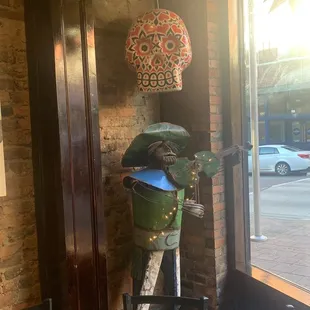 a parking meter and a roll of toilet paper