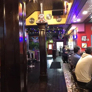 people sitting at tables in a restaurant