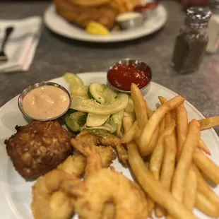 Shrimp with a petite crab cake.   Flounder with fries.