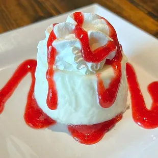 We have a treat for you, this simple and light dessert will have you singing our praises! Vanilla panna cotta w/ strawberry drizzle.