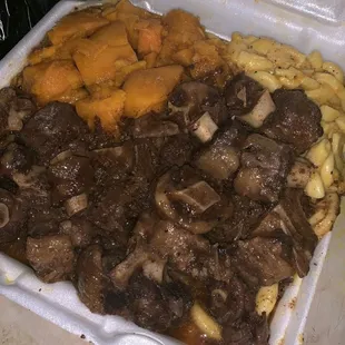 Oxtails, Mac and cheese,  and sweet potatoes,
