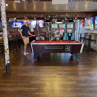 a man playing a game of pool