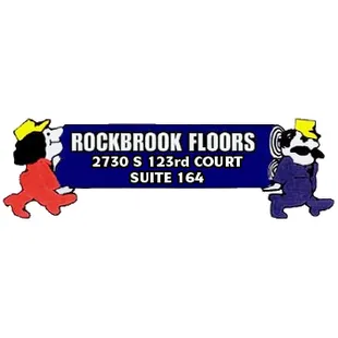 a picture of a man and woman walking in front of a rockbrook floor sign
