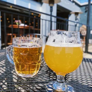 two glasses of beer on a table