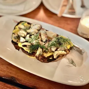 Totten Inlet Mussels Bruschetta, saffron aioli, garlic confit, dill, sea salt