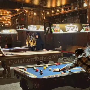 a man playing pool