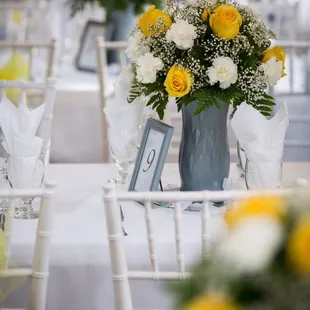 Simple table setting. We only added the flowers and table numbers, they did the rest.