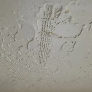 This ceiling was completely replaced and left like this.  It's very noticeable from the room.