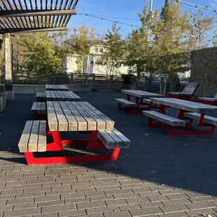 picnic tables on a brick patio