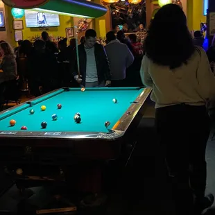 a pool table with a pool ball on it