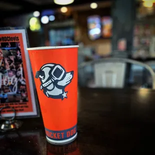 a drink in a paper cup