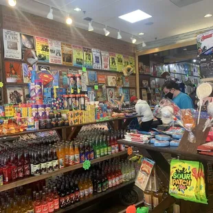 people in a store with various products