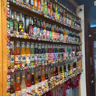 a wall of soda bottles