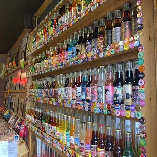 a wall of soda bottles