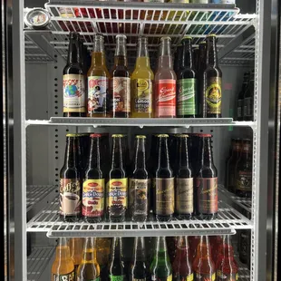 a refrigerator full of beer bottles