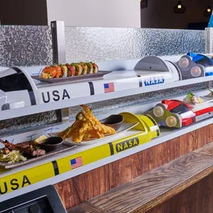 Omakase, chicken Katsu Don on Rockets. Order from tablets w/ pictures &amp; watch freshly prepared dishes come on Rockets conveyor belt.