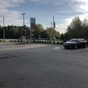 a black car parked in a parking lot