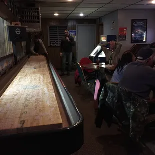 people playing a game of bowling