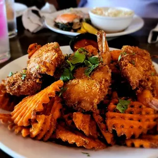 a plate of fried fish and waffles