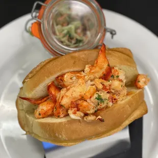 a lobster sandwich with coleslaw