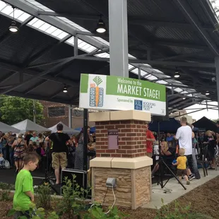 a crowd of people standing in line