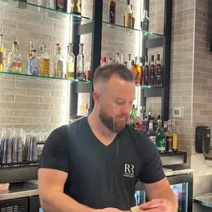 Mitchell is one of the owners and a mad mixologist for cocktails or talking about your favorite sports.