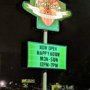 neon sign for happy hour