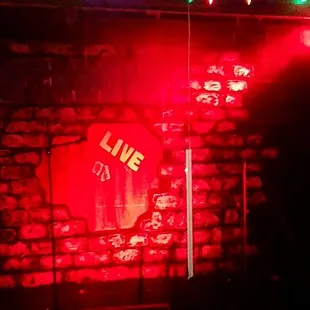 a brick wall with neon lights