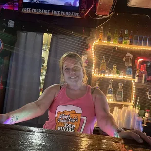 a woman sitting at a bar