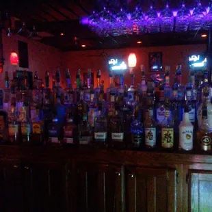 a bar filled with liquor bottles