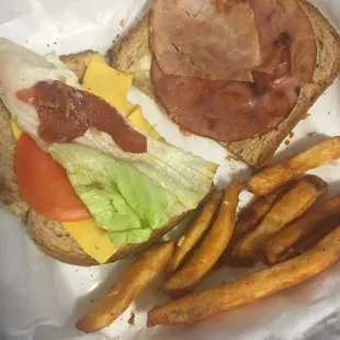 Only two slices of deli meat and a quarter of a slice of bacon for this disappointing club sandwich.