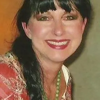 Laura E.