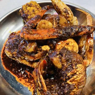 1/2lb crab legs, 1/2lb shrimp, 4 sides, and a lobster tail.