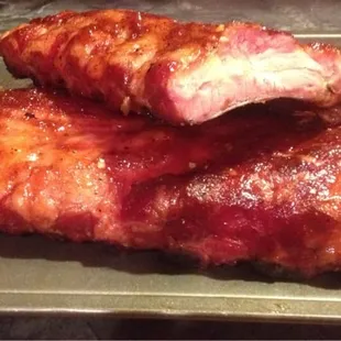 two ribs on a baking sheet