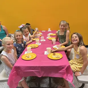 Pink party supplies provided by venue.