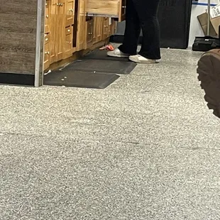 Garbage all over the place, even staff is stepping and working around it!