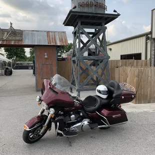  motorcycle parked in front of a water tower