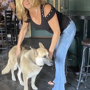  woman petting a dog
