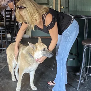  woman petting a dog