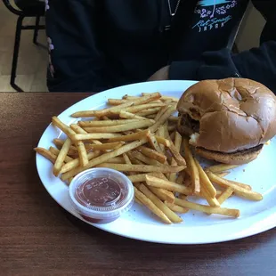 Hamburger with cheese and fries.