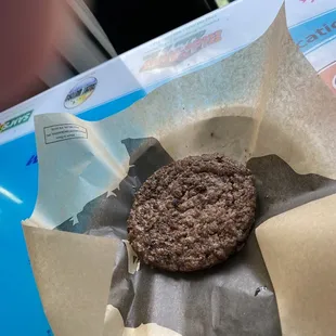  a chocolate cookie in a paper wrapper