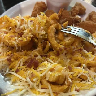 Loaded curly fries (shrimp in background)