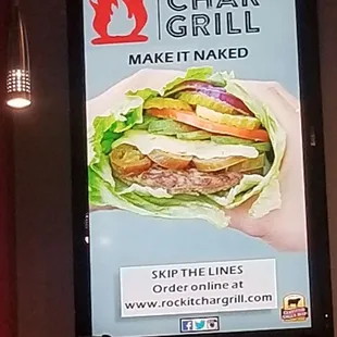 a man standing in front of a sign