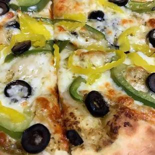 a pizza with olives and peppers