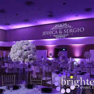 Stunning wedding at Rocklin Event Center w/ deep purple uplighting+ monogram by Brighten Up Event Lighting www.brightenuplighting.com