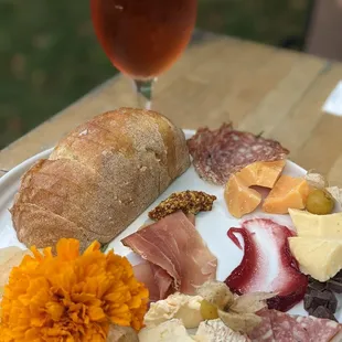 Cheese &amp; charcuterie board (9/18/2021), with a cerise in the background.