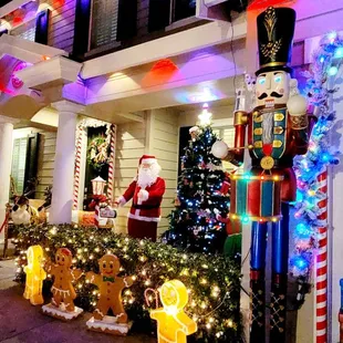 Nutcracker, a dancing Santa, a climbing Santa, a gingerbread photo op and more. Love this house.