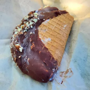 Mint chip ice cream taco with dark chocolate and almonds