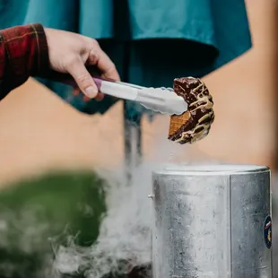  a man scooping ice cream into a bucket