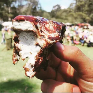 SMORE taco. House-made marshmallow, toasted and put inside waffle taco cone, dipped in dark chocolate.